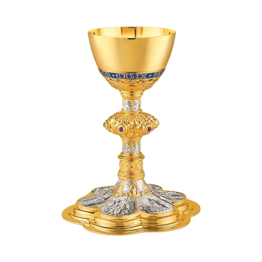 Chalice & Scale Paten in neo-gothic style with scenes from the New 
Testament and cup inscription: “HIC EST ENIM CALIX SANGUINIS MEI” 
9 5/8” Ht. sold by The Clergy Store