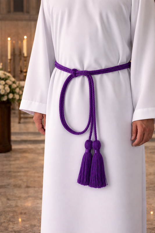Purple cincture with tassels on a white liturgical alb