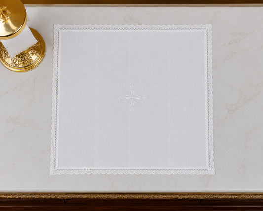 Square Italian linen corporal with lace edge and embroidered cross. 