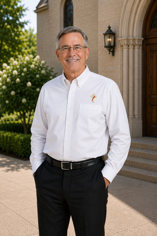 Deacon wearing a long sleeve white shirt with an embroidered symbol of a deacons cross on his left chest.