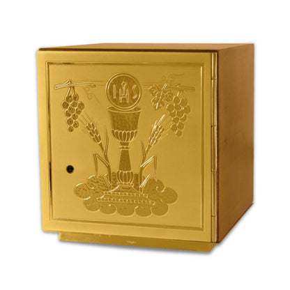 Single door tabernacle with chiseled image of a chalice, grapes, and ears of wheat sourrounded by a wood casing. Made in Italy and sold by The Clergy Store