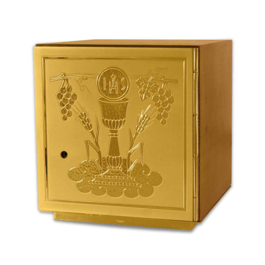 Single door tabernacle with chiseled image of a chalice, grapes, and ears of wheat sourrounded by a wood casing. Made in Italy and sold by The Clergy Store