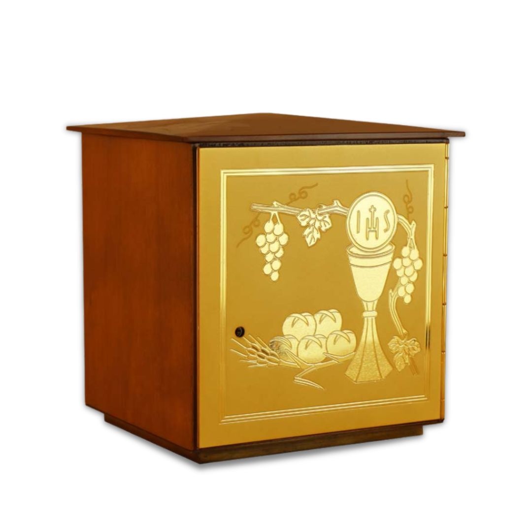 Single door tabernacle with chiseled image of a chalice, grapes, and ears of wheat sourrounded by a wood casing. Made in Italy and sold by The Clergy Store