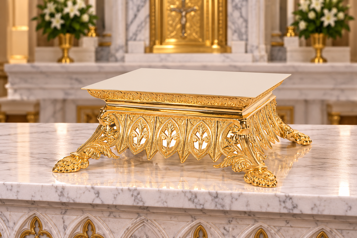 An ornate gold-toned altar thabor monstrance stand