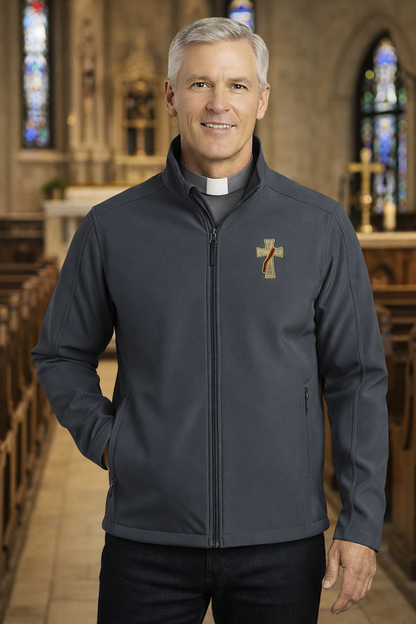 Man wearing a gray deacon jacket with a logo in a church setting