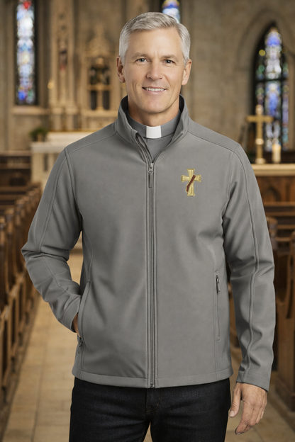 Man wearing a gray deacon jacket with a logo in a church setting