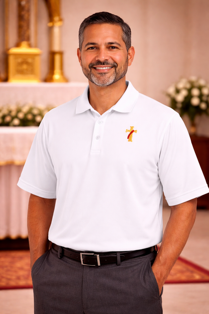 Man wearing a white polo shirt with a deacon logo.