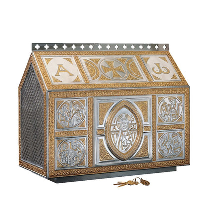 Delicate chest-type tabernacle, with filigree celtic ornamentation matching our “Tassilo” chalice.
 Rich ornamented interior in 24 karat Gold Plate. 19 1/2” High x 24” Wide x 11 1/2” Deep.Single door opening: 8 3/4” High by 8 3/4” Wide. Sold by The Clergy Store